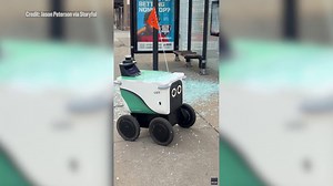 Chicago delivery robot after shattering glass at CTA bus shelter: VIDEO