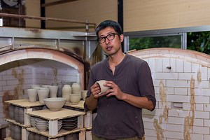 Freshly baked pottery sits in a kiln waiting to be painted by the...