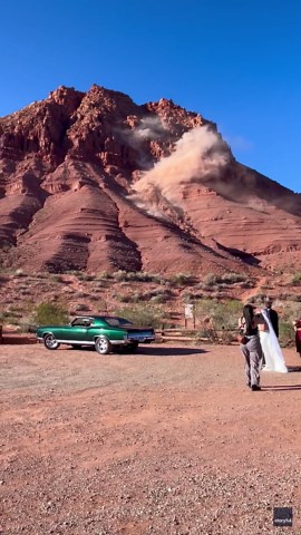 Rockslide steals show as couple takes wedding photos in Utah