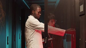Two Colleagues Checking on Rack Server Cabinet