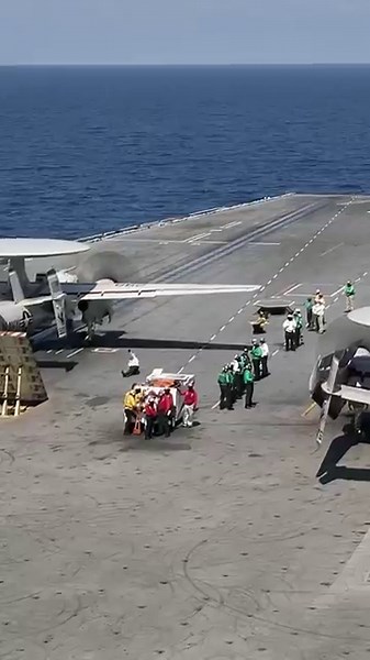 See the takeoff and landing of an E-2 Hawkeye on an aircraft carrier