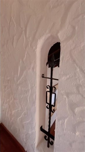 Love this detail. A little peek-a-boo opening overlooking the grand living room.