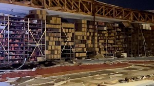 Wall blown off Auto Zone, flooding on Speedway after Monsoon