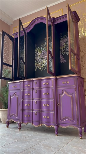 Katarina Hernandez on Instagram: "Gorgeous China Cabinet Makeover using Purple Emperor Color for the outside and Shadow grey for the inside. Beautiful transfer is by @redesignwithprima called Vigorous Violet 😍 All products are available on our website kachafurniture.com #kachafurniture #furnitureartist #kachafurniturepaint #redesignwithprima #furnituremakeover #furnituremakeover"
