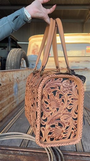 She’s back and bolder than ever, cowgirl! The Speedy Purse 2.0 – Natural & Black brings together the best of Western craftsmanship and modern style — deep floral tooling, sturdy rolled handles, and that classic tooled leather shine you can spot a mile away. Shop this Heels N Spurs exclusive before it’s gone. https://www.heelsnspurs.com/products/the-speedy-purse-2-0-natural-black?_pos=1&_fid=577f966df&_ss=c | Heels N Spurs