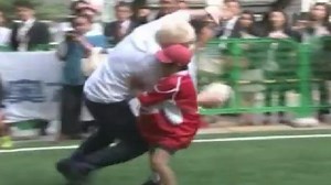 Boris Johnson rugby tackles 10-year-old boy in Japan