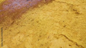 Sulfur stream after rare raine, dropped, supersaturated solutions, chemical fluvial sediments, Mountains of volcanic origin. Hormuz Island, Iran