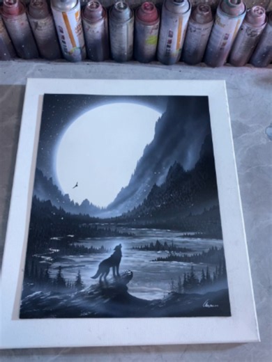 Spray-painted lone wolf howling at the moon
