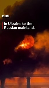 A fire broke out after an explosion on the only bridge connecting occupied Crimea and Russia. Ukrainians have been reacting after the blast on the crossing, which was a key supply route for Russia's invasion. https://bbc.in/3yOcLoP | BBC News