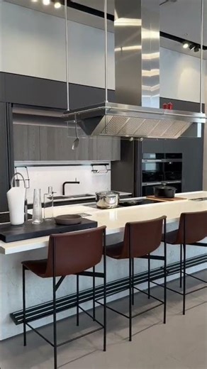 A sleek, contemporary kitchen defined by clean geometry and contrast.