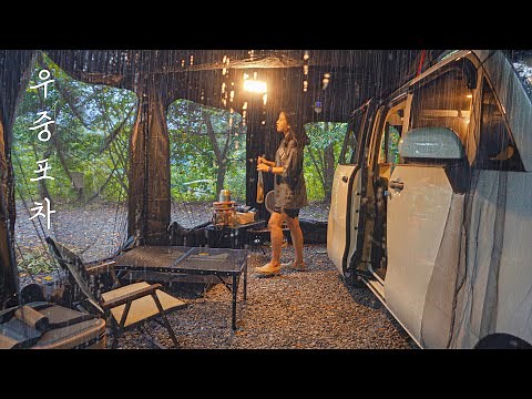 Solo camping in the rain in my small black cart bar