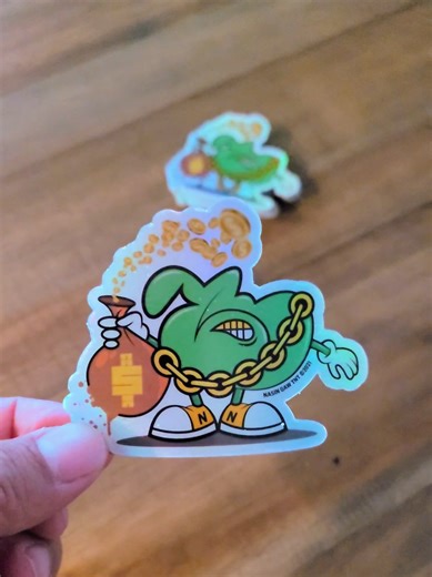 Holographic Stickers That Shine From Every Angle ✨ Eye‑catching, durable, and full of color-shifting shine. These holographic stickers instantly level up any surface with bold, reflective effects that stand out day or night. #slapsworldwide #vinylstickers #diecutstickers #holographicstickers #stickerprinting