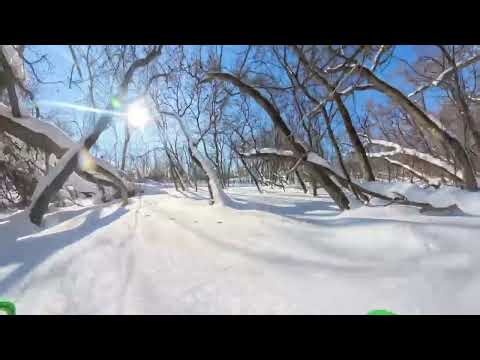 Riding the snowmobile over to the Island to explore