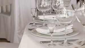 clip-7391191-focus-serve-wine-glasses-on-celebratory-table