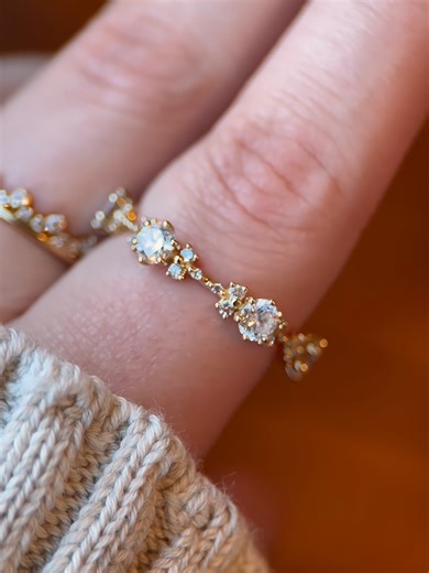 THE CLUSTER DROP IS LIVE 💫 The new Cloudbreak Band bursts in bright diamonds. This eternity band features diamond clusters incrementally spread along a pave band in your choice of 14k gold or platinum. These clusters repeat around the entire band, causing the diamonds to appear to be pulsing like a twinkling star.