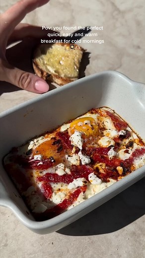 Baked Eggs with Sun-Dried Tomato, Goat Cheese, and Chilli Oil Recipe