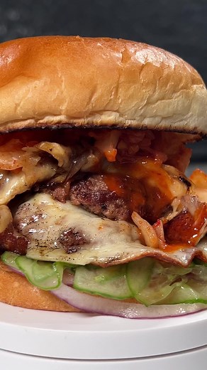 This is what I named a taste of Korea double smash cheeseburger. Wake up your taste buds with gochujang, kimchi, quick picked cucumber and red onions. Full recipe will be published on the website @revolutionbbq #kimchi #koreaninspired #smashburger #cheeseburgers #foodreel #reelsinstagram #reelsfacebook #food #beef #coloradobbq #revolutionbbq #metaverse #meatsweats #quickrecipes #thorntoncolorado #303eats #reelsusa | Revolution Barbecue