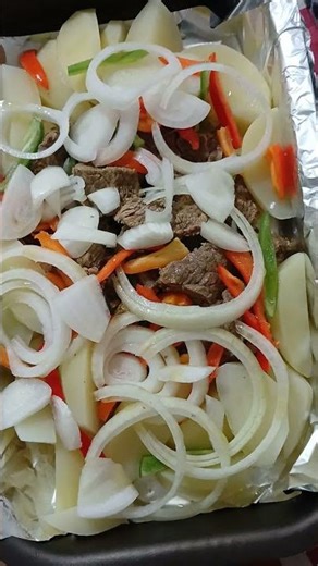 Chuck roast cooked in a pressure cooker and then baked in the oven with potatoes.