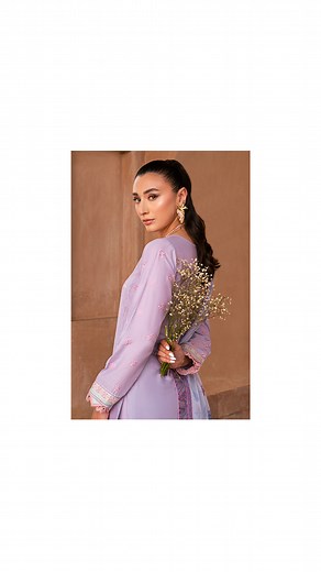 Presenting Color of the Season, Lilly, a fully Embroidered shirt front on lawn, embroidered sleeves on lawn with contrast details and matching pants while paired with digital printed silk dupatta. An incandescent, richly embroidered design features delicate yet elaborate embroideries in shades of purple, Laguna ice blue and ivory laid stitch by stitch on a delicate lilac canvas layered with anglaise pattern. The shirt is accompanied by intricate borders with embroideries creating an exuberance o