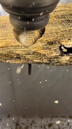 the process of forming wood into small balls using a special machine