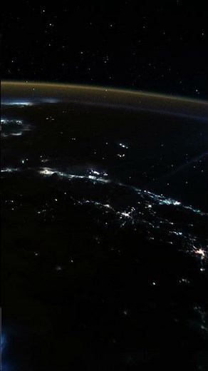 WHAT ARE THE STRANGE BLUE SPOTLIGHTS FLOATING ABOVE THE EARTH CAPTURED BY AN ASTRONOMIST?