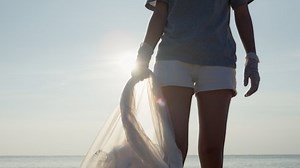 Save water. Volunteer pick up trash garbage at the beach and plastic bottles are difficult decompose prevent harm aquatic life. Earth, Environment, Greening planet, reduce global warming, Save world