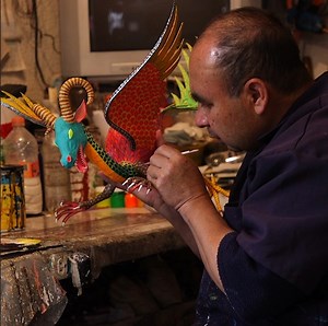 Alebrijes are brightly colored sculptures of magical creatures. The first alebrijes came from one artist, Pedro Linares, in Mexico. | Business Insider Today