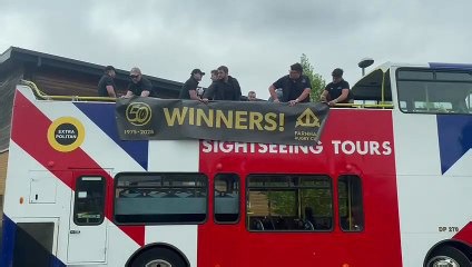 Farnham Rugby Club team members at the start of their open bus trophy parade