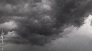 Time Lapse of dramatic afternoon Sky with storm forming. Clouds are semi back lit and moving towards the camera creating a volumetric light. It gives the illusion of flying trough the sky.