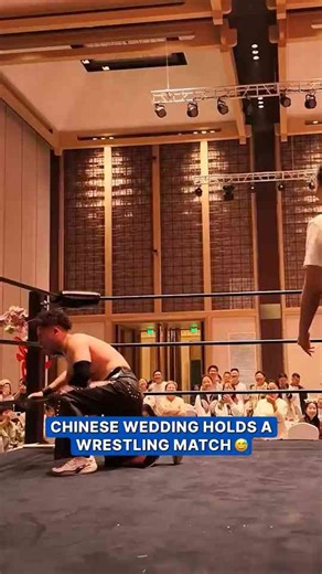 Newlyweds settle housework duties with wrestling match at wedding