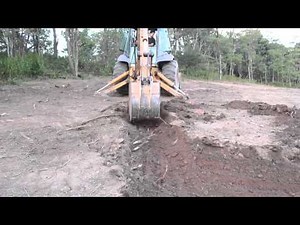 Stripping Topsoil with the Backhoe