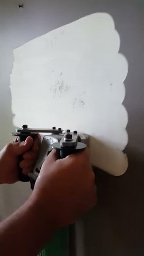Paintshaver stripping plastered wall
