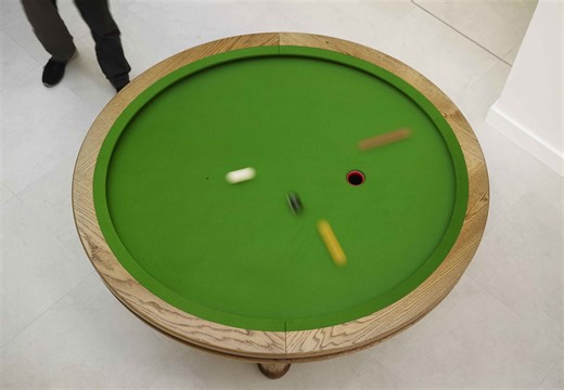 A Unique Elliptical Pool Table and 'Loop' Game Designed by a Mathematician