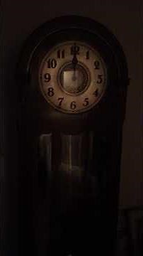 Grandfather clock strikes 12