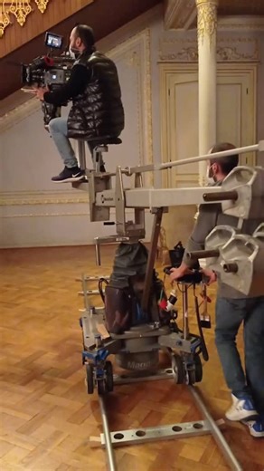 Cameraman Prepares for Opulent Film Shoot