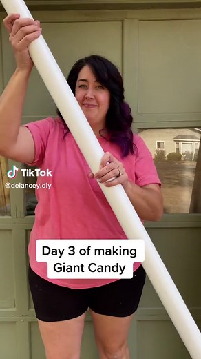 Giant candy canes from 2” PVC pipes. #giantcandy #gingerbreadplayhouse