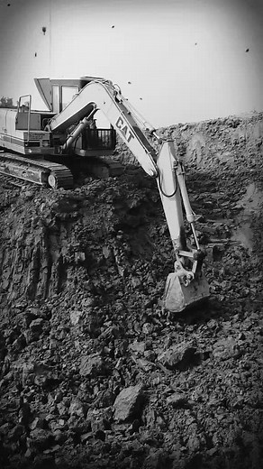 CAT Excavator at Construction Site: Soil Digging Process