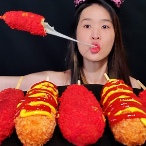 Eating Korean-Style Corn Dogs from Mochinut! They are the best I've had so far, I'd highly recommend it! Have you tried it? #mukbang #asmr #corndogs #hotdogs #eatingshow #eatingasmr #eating #cheeselover #cheese #cheetos | Peggie Neo