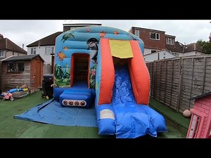 Setting Up A Bouncy Castle With Slide On ARTIFICIAL GRASS - Bouncy castle videos