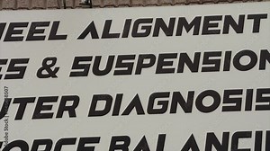 auto shop sign listing services - 3d wheel alignment, brakes and suspension, computer diagnosis, roadforce balancing, wheels and tires, ac service, oil changes, exhaust repairs - pan left to right