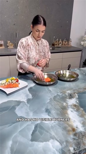 SuperArchitects™️ on Instagram: "INVISICOOK 👻👩🏻‍🍳 @invisacook_europe Cooking directly on a countertop that remains cool to the touch may sound impossible, yet modern innovation has made it a reality. Invisacook uses advanced invisible induction technology, allowing heat to transfer only to the cookware — while the surface itself stays perfectly safe and cool. There are no visible burners, no bulky appliances, and no separation between cooking and design. This cutting-edge system is installed