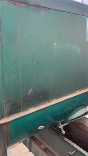 John shows how the flat filler works! We bought this a few weeks ago. It turns and mixes the soil medium and then fills trays for us! (No trays shown in this demo because they were already done). We love collecting fun machines like this!! | Shared Legacy Farms