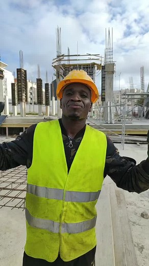 Construction Worker Communicates at Job Site