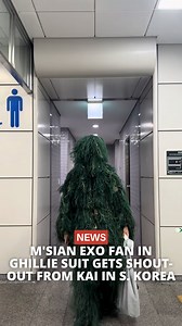 Malaysian EXO fan Naufal Omar stole the spotlight at Kai's 'KAION' solo concert in Seoul, South Korea by showing up in a full ghillie suit to match the show's military-themed dress code. His bold look even caught Kai's attention, who jokingly asked, "Aren't you hot?" and told him to take a cold shower after the show. Since the video went viral, fans have praised Naufal's dedication, especially since Kai remembered him from three years ago. #news #malaysia #exo | The Smart Local Malaysia