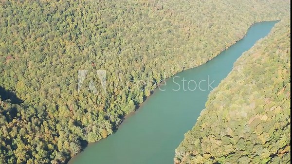 Aerial drone flight down the Cheat River flowing through narrow wooded gorge in the autumn towards Cheat Lake near Morgantown, WV