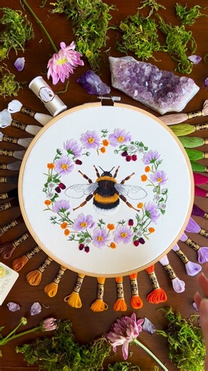Kate • Hand Embroidery & Textile Artist on Instagram: "What is that one art piece that you are the *MOST* proud of? My Bumble Bee in Wildflower Wreath embroidery is probably it for me. It was my first really large hand embroidery project, and it took a lot of time to stitch. But I kept at it and just proved to myself that I’m capable of doing anything I set my mind to. Since then, I’ve added the Red Rose from my Language of Flowers thread painting series to my roster of large embroidery projects