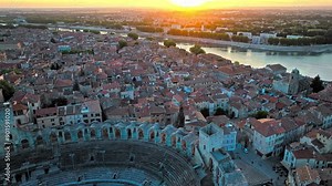 Panorama of ancient town Arles in Provence and Cote d'Azur, France, South Europe. Aerial view of Ancient, 2-tiered Roman gladiatorial amphitheatre hosting bullfighting and community events.