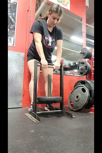 Standing Grip Strength Squeezes using Plate Loaded Grip Trainer