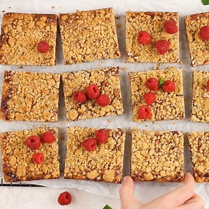 9.8K views · 127 reactions | These raspberry crumble bars are so simple to throw together – they're made with a cake mix! Make these for a last-minute get together, or whenever the craving strikes. Raspberry Bars >>> https://www.mybakingaddiction.com/super-easy-oatmeal-jam-bars-award | My Baking Addiction | Facebook