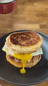 This is my new favorite breakfast sandwich! CJ is using his indoor griddle to make these amazing cinnimon roll breakfast smashburgers. Sausage patties, crispy hashbrowns, sunnyside up egg and sweet cinnimon rolls! What would you add to this sandwich? Ingredients: -Canned cinnimon rolls. -Egg cooked sunnyside up. -Breakfast sausage. -American cheese. -Hashbrown patties. Prep: -Smash the sausage into patties, cook all the way through and top with American cheese. -Add the hashbrown patties and coo